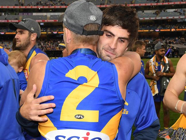 Mark LeCras (left) and Andrew Gaff (second from left) of the Eagles embrace after the 2018 AFL Grand Final between the West Coast Eagles and the Collingwood Magpies at the MCG in Melbourne, Saturday, September 29, 2018. (AAP Image/Julian Smith) NO ARCHIVING, EDITORIAL USE ONLY