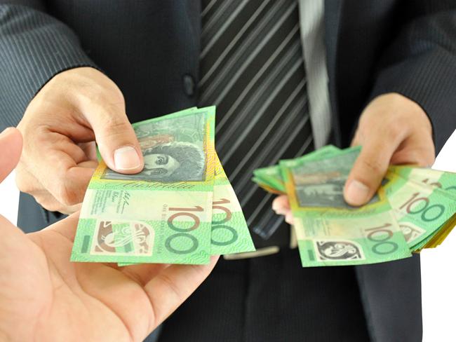 Businessman handing, giving money  - Australian dollars