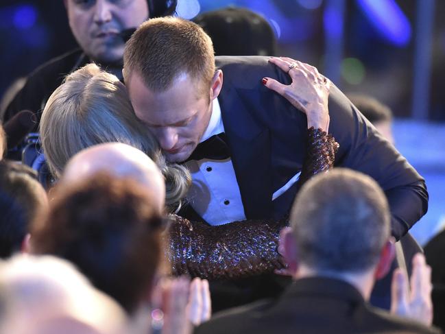 Alexander Skarsgard is congratulated in the audience by Nicole Kidman as he accepts the award for outstanding performance by a male actor in a television movie or limited series for “Big Little Lies” at the 24th annual Screen Actors Guild Awards. Picture: AP