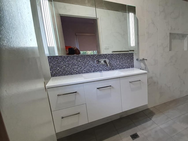 A happy customer of the tiling business. Source: Facebook.