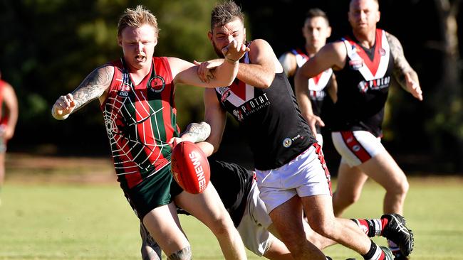 North Pines player Rhys Dawson tries to avoid two Para Hills players in 2017. Picture: Bianca De Marchi