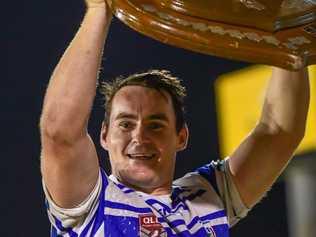 Kevin Sherriff holds the shield aloft for the Bundaberg Past Brothers.