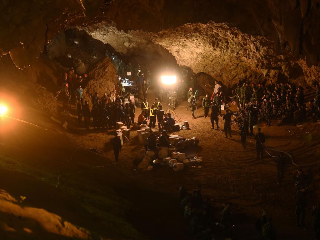 Discovery Channel special on the Thai Cave Rescue shows Thai soldiers relaying electric cable deep into the Tham Luang cave at the Khun Nam Nang Non Forest Park in Chiang Rai on June 26, 2018 during a rescue operation for a missing children's football team and their coach. - Desperate parents led a prayer ceremony outside a flooded cave in northern Thailand where 12 children and their football coach have been trapped for days, as military rescue divers packing food rations resumed their search on June 26. (Photo by Lillian SUWANRUMPHA / AFP) (Photo credit should read LILLIAN SUWANRUMPHA/AFP/Getty Images)