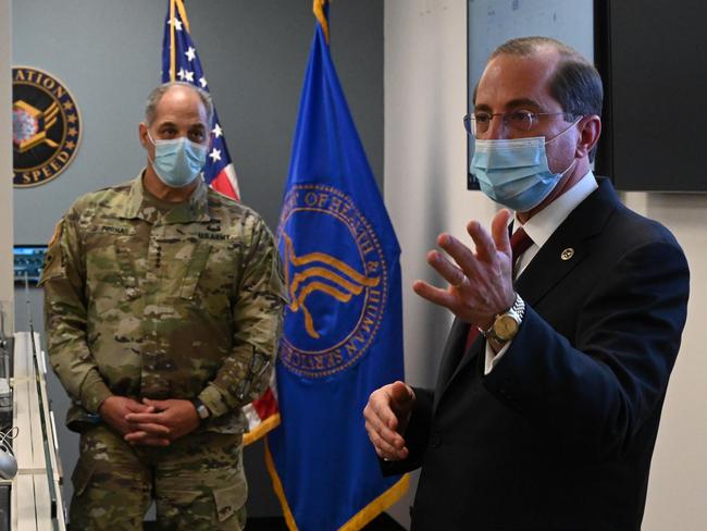 US Health and Human Services Secretary Alex Azar, right, and General Gus Perna at the Operation Warp Speed Vaccine Operation Centre in in Washignton. Picture: AFP