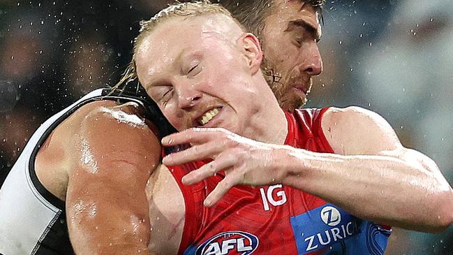 ADELAIDE, AUSTRALIA - MAY 19: Clayton Oliver of the Demons and Scott Lycett of the Power during the 2023 AFL Round 10 match between Yartapuulti/Port Adelaide Power and Narrm/Melbourne Demons at Adelaide Oval on May 19, 2023 in Adelaide, Australia. (Photo by Sarah Reed/AFL Photos via Getty Images)