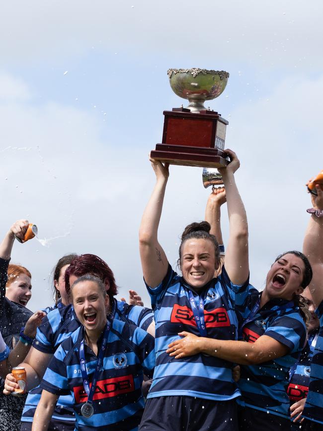 Burnside women's captain Johanna Redden lifts the premiership cup. Picture: Yulia Dinan