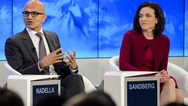 CEO of Microsoft Corporation Satya Nadella, left, and Chief Operating Officer of Facebook Sheryl Sandberg, right, speak during a panel session on the first day of the Annual Meeting of the World Economic Forum, WEF, in Davos, Switzerland, Wednesday, Jan. 20, 2016. (Jean-Christophe Bott/Keystone via AP)