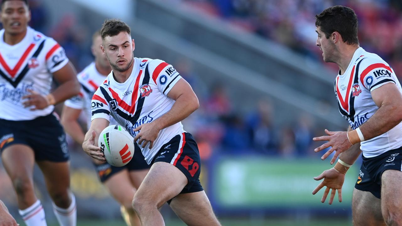 Sandon Smith pops a pass for Nat Butcher who raced away to score against Newcastle. Picture: NRL Imagery