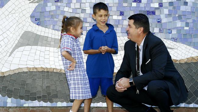 From left students Layla and Brooklyn share a joke with Mr Jackman. Picture: John Appleyard