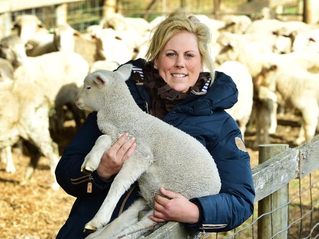 COUNTRY LIVING: Women in AgricultureLivestock contractor Lisa Virgona spends seven months of the year heading a team that prepares 150,000 lambs to live healthy lives through marking, mulesing and vaccinating. Lisa found herself as district livestock contractor for sheep producers in Western Victoria almost by accident. The turning point came when, while still doing her school-based farm apprenticeship, Lisa met Roydan Barnett, who had been mulesing sheep for more than 50 years. Over the following few years she worked with Roydan on and off and learned the ropes, eventually taking over the business from him.Pictured: Lisa Virgona with a lamb.PICTURE: ZOE PHILLIPS