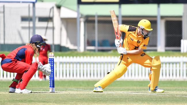 East Torren ‘keeper Coby Cornish watches as Glenelg’s Tom Plant shapes to drive yesterday Picture: AAP/ Keryn Stevens