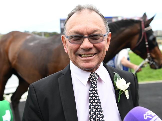 Trainer Gary Moore laughs after winning the Ilve Appliances Hill Stakes race with his horse Classic Uniform during the TAB Epsom Day at Randwick Racecourse in Sydney, Saturday, September 30, 2017. (AAP Image/David Moir) NO ARCHIVING, EDITORIAL USE ONLY