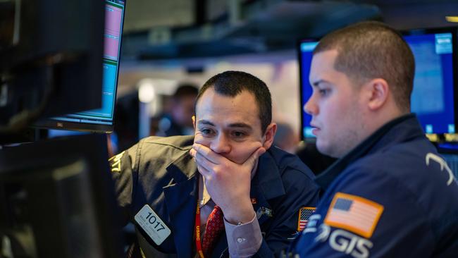 Traders working the floor of the New York Stock Exchange on January 31.