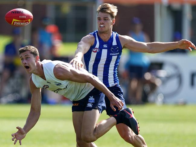 Charlie Comben battles it out with Mason Wood during pre-season training last year. Picture: AAP Image/Sean Garnsworthy