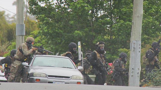 Heavily armed police officers at the siege. Picture: BRUCE MOUNSTER