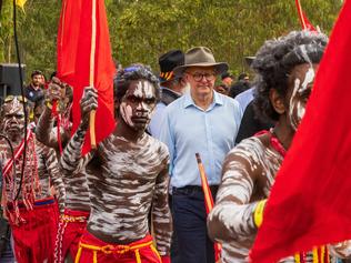 EAST ARNHEM, AUSTRALIA - JULY 29: Prime Minister of Australia Anthony Albanese with Yolngu men during Garma Festival 2022 at Gulkula on July 29, 2022 in East Arnhem, Australia. The annual Garma festival is held at Gulkula, a significant ceremonial site for the Yolngu people of northeast Arnhem Land about 40km from Nhulunbuy on the Gove peninsula in East Arnhem. The festival is a celebration of Yolngu culture aimed at sharing culture and knowledge which also brings politicians and Indigenous leaders together to discuss issues facing Australia's Aboriginal and Torres Strait Islander people. This year is the first time the festival has been held since 2019 following a two-year absence due to the COVID-19 pandemic. (Photo by Tamati Smith/Getty Images)