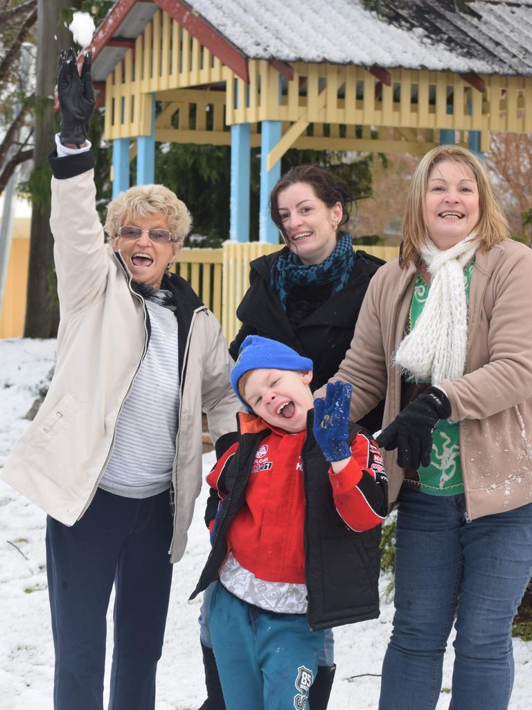 Four generations seeing snow for the first time. Cavil, Christie, William and Karen Monement. Photo: Alex Nolan / Stanthorpe Border Post