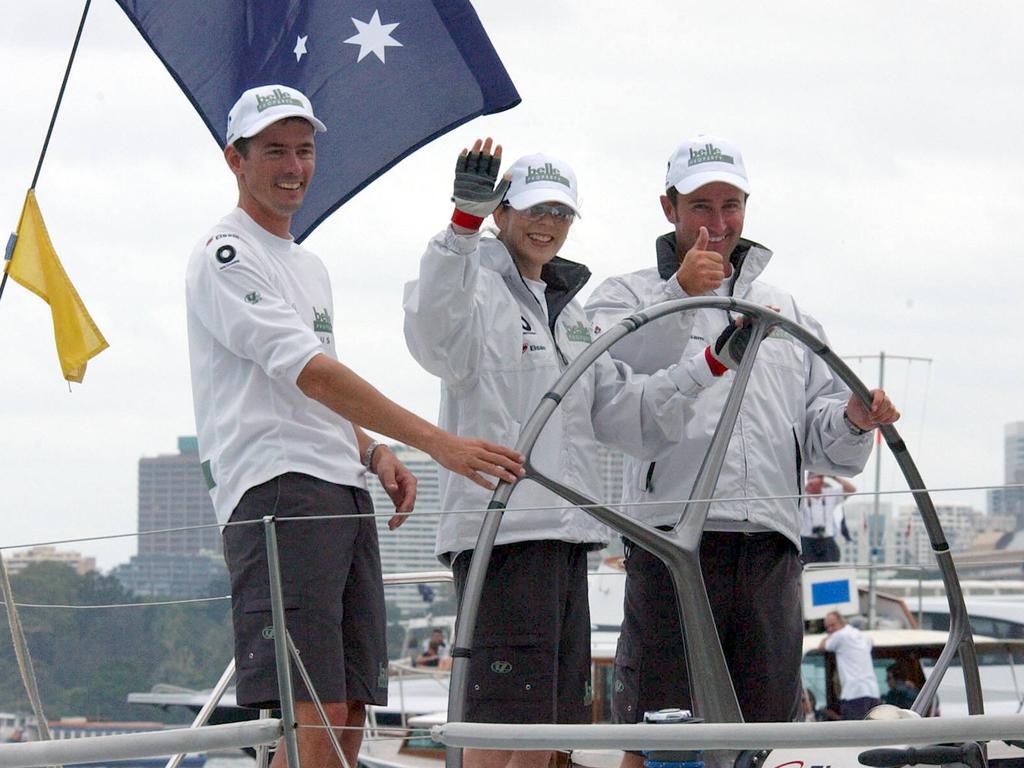 Princess Mary gives a wave while Cris Meehin gives thumbs up after their victory over Princess Frederik in a race on Sydney Harbour. Picture: Ian Mainsbridge