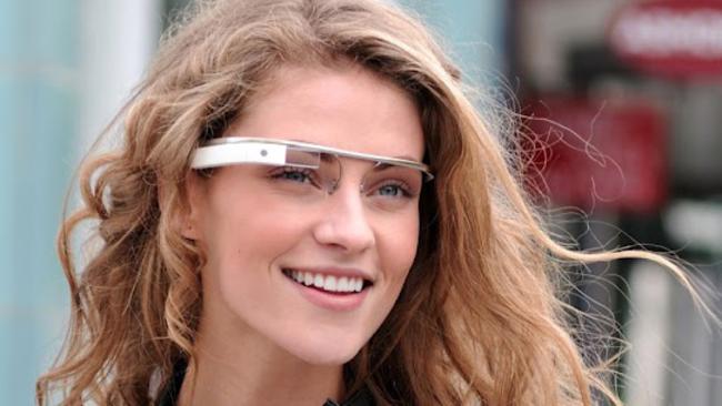 In this undated handout photo provided by the Google[x] group's 'Project Glass', an early prototype of Google's futuristic Internet-connected glasses, are modelled. The specs are said to give you directions, let you video chat, shop and do everything else you now need a handheld gadget to accomplish. Google gave a glimpse of 'Project Glass' in a video and blog post this week.