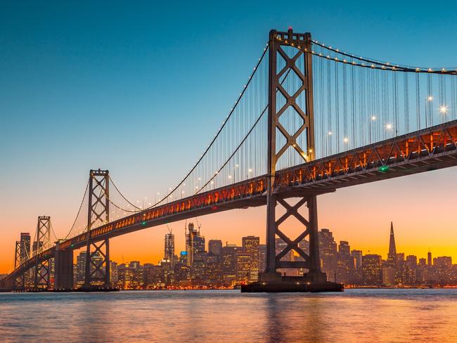 Classic panoramic view of San Francisco skyline with famous Oakland Bay Bridge illuminated in beautiful golden evening light at sunset in summer, San Francisco Bay Area, California, USA. Picture: iStockCatherine Best, Sightseeing 101, Escape