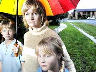 Anthony Buckingham, 11, and Tamsin Buckingham, 10, with mum Richelle Buckingham of Ballina, who has been taken to court and fined by the Ballina Shire Council for having a trampoline set up on the footpath. . Picture: Jay Cronan