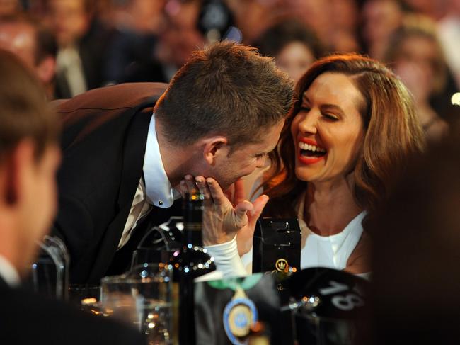 Australian cricket captain Michael Clarke is congratulated by his wife Kyly after he won the 2013 Allan Border Medal at Crown in Melbourne. Picture: Joe Castro