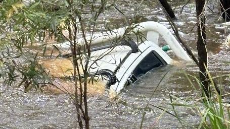 A ute has been fully submerged in floodwater at Yengarie.