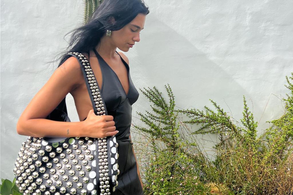 Dua Lipa's leather dress and studded bag combo proves summer looks