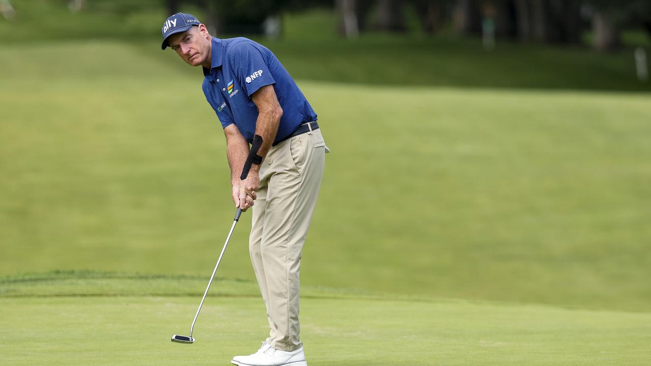 Jim Furyk watches a putt on the first hole. Photo by Mike Mulholland/Getty Images