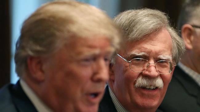 Donald Trump, left, sacked national security adviser John Bolton, right, in September. Picture: Mark Wilson/Getty/AFP