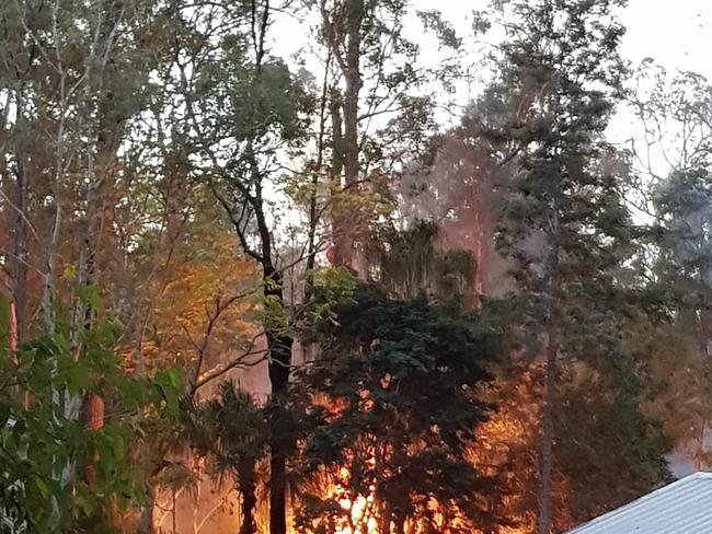 The rural fire service carries out a hazard reduction burn near houses in The Palms in May this year. Pictures: The Palms Rural Fire Brigade