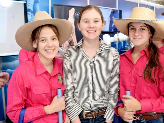 BEEF AUSTRALIA 21: Clare Hills (centre) from Rockhampton Girls Grammar tries out the virtual reality meat processing system