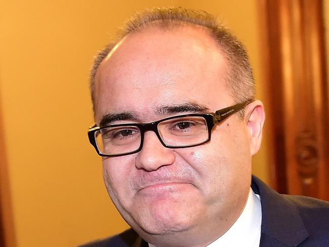 Former Victorian Small Business Minister Adem Somyurek leaves a media conference at Victorian parliament in Melbourne, Tuesday, July 28, 2015. Somyurek has resigned from the ministry following bullying allegations made by his former chief of staff. (AAP Image/Julian Smith) NO ARCHIVING