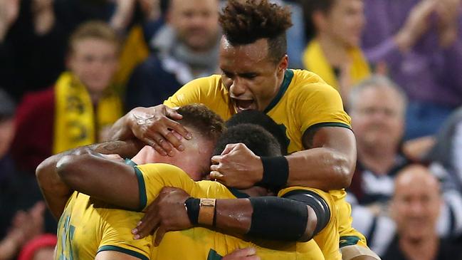 Will Genia joins the celebrations after Reece Hodge scored for the Wallabies. Picture: Getty Images