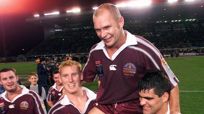 Allan Langer carried off by teammates Brad Meyers and John Buttigieg in 2001.