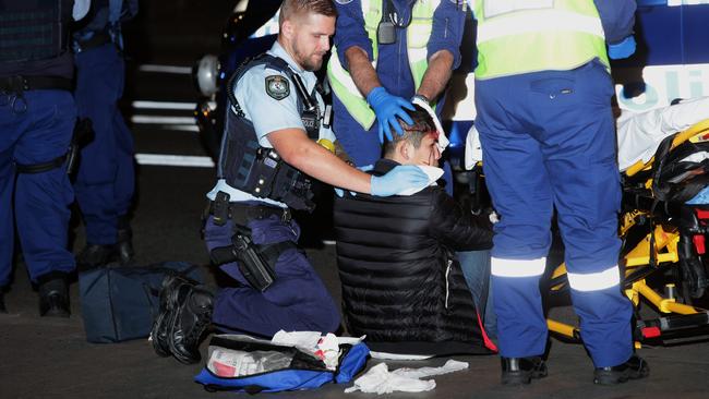 The pedestrian being treated after the collision. Picture: Bill Hearne