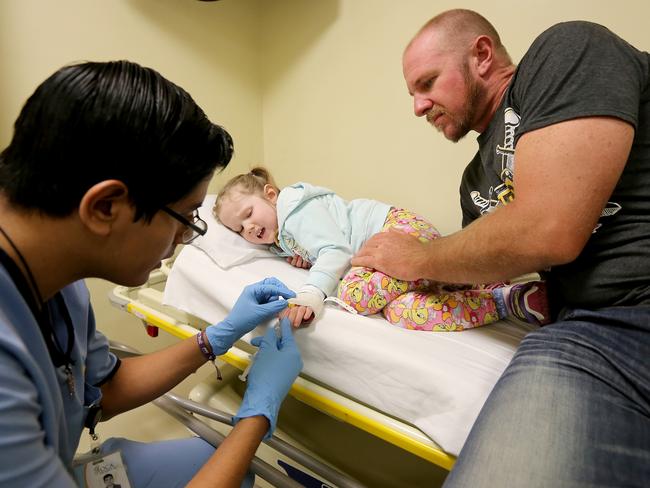 Australian girl Annabelle Potts with her father Adam at the OCA Hospital in Monterrey Mexico, where she is undergoing treatment for brain cancer. Picture: Nathan Edwards