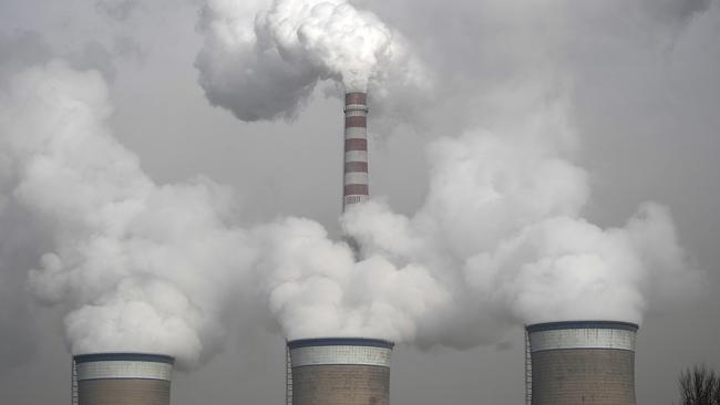 Smoke is seen emitted from chimneys of the cooling towers of a coal-fired power plant in Dadong, Shanxi province, China. Picture: AP