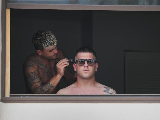 Nicole Spuntarilli cuts the hair of Stefano Pinto in his apartment due to hair salons and barber shops being closed in Miami Beach, Florida. Picture: Getty Images/AFP