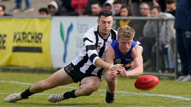 Narre Warren’s Hayden Johnson tackles Cody Hirst (Wandin). Picture: Valeriu Campan