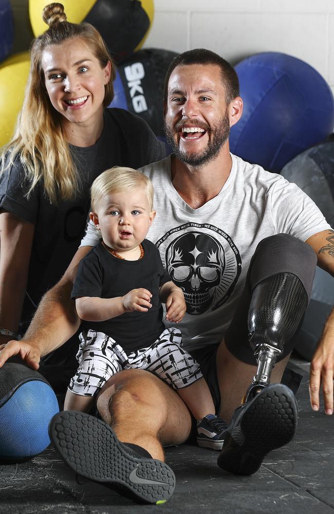 In the gym with wife Jessica and one-year-old won Wolf. Picture: Sarah Reed.