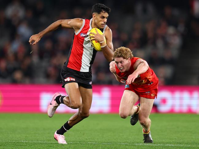 MELBOURNE, AUSTRALIA - JUNE 08: Nasiah Wanganeen-Milera of the Saints is tackled by Matt Rowell of the Suns during the round 13 AFL match between St Kilda Saints and Gold Coast Suns at Marvel Stadium on June 08, 2024 in Melbourne, Australia. (Photo by Graham Denholm/Getty Images)