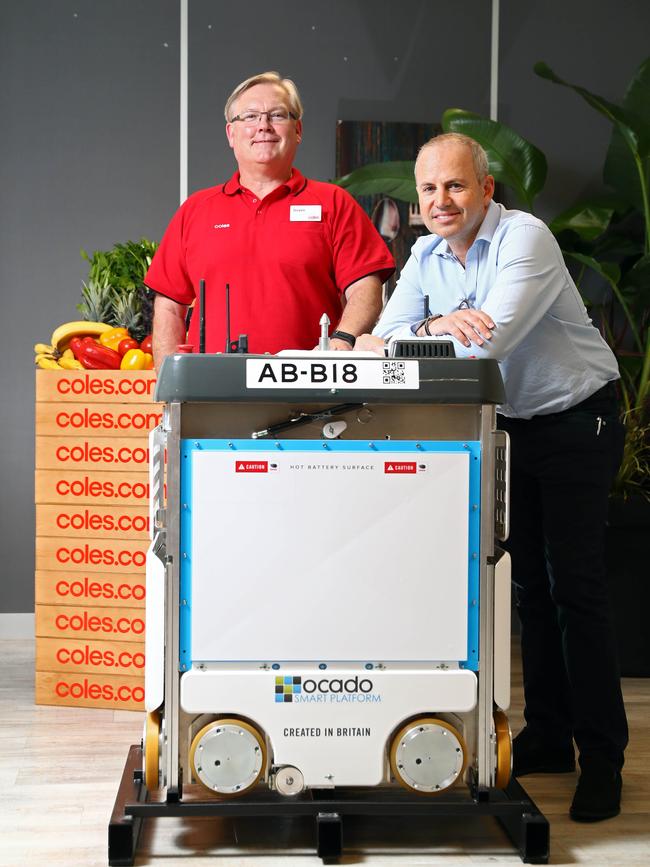 Coles CEO Steven Cain with Ocado CEO Tim Steiner with their new Ocado bot. Aaron Francis/The Australian