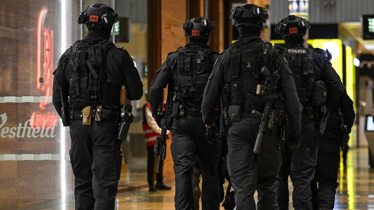 Armed police enter the Westfield Marion shopping centre in Adelaide on June 23, 2024, after the mall went into lockdown following a security incident. Picture: Michael Errey / AFP