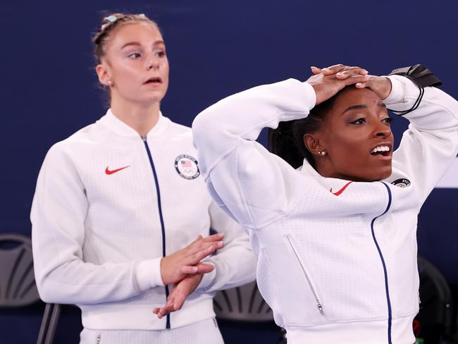 Grace McCallum and Simone Biles of Team United States react during the Women's Team Final on day four of the Tokyo 2020 Olympic Games.