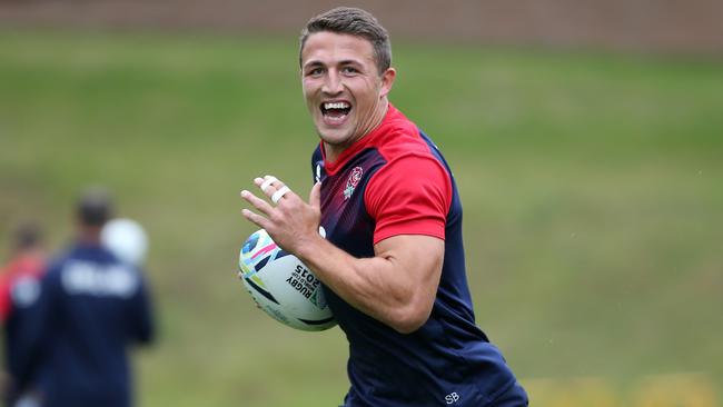 Sam Burgess runs with the ball during the England training session held at Pennyhill Park.