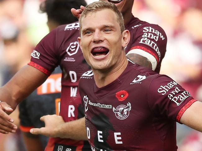 SYDNEY, AUSTRALIA - APRIL 25:  Tom Trbojevic of the Sea Eagles celebrates with team mates after scoring a try during the round seven NRL match between the Wests Tigers and the Manly Sea Eagles at Bankwest Stadium, on April 25, 2021, in Sydney, Australia. (Photo by Matt King/Getty Images)