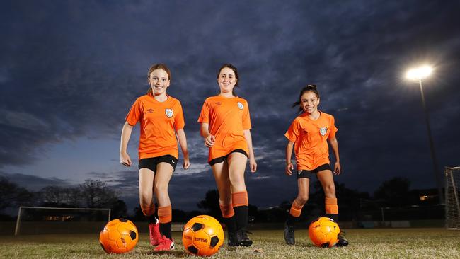 Lauren Vickers, 10, Asher Osborne-Millard, 10, and Kaia Taniora, 10, from Grange Thistle Football Club. Picture: Josh Woning