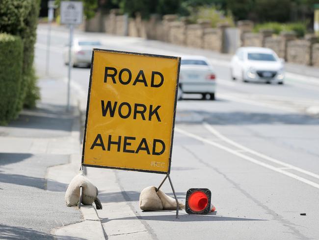 Roadworks sign on Sandy Bay road. Traffic, road works, development, transit. generic