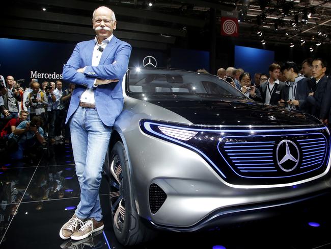 Dieter Zetsche, CEO of the Daimler AG, stands next to the Mercedes EQ concept car at the Paris Auto Show. Picture: AP / Michel Euler